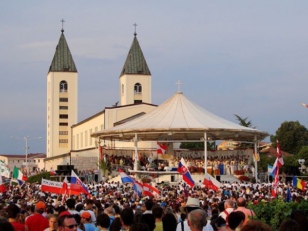 Medjugorje festival: the parish church of St James, and the pavilion where the "seers" have their "visions" because the bishop forbids them from doing so in the church