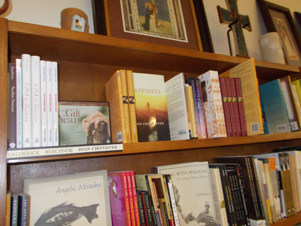 At Sinsinawa Mound Gift shop, a whole shelf of Joan Chittister's books, with a shelf or two of Thomas Merton below.