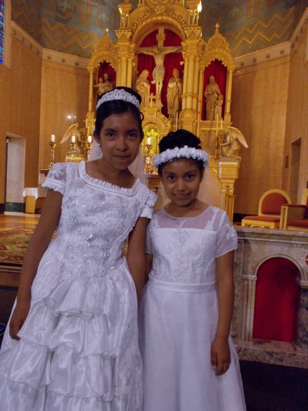 Brand new Christians! Isabel and Leslie after their baptism at Holy Redeemer Church in June.