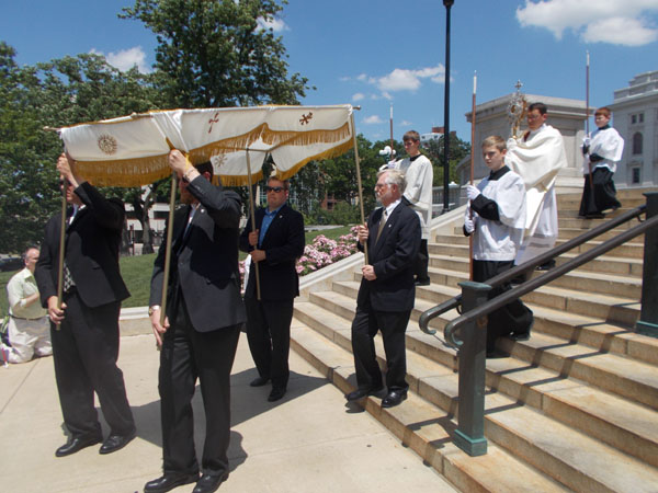Preparing to head back down the Capitol Steps, bringing the Blessed Sacrament under the canopy. This is Deacon Garrett Kau with the monstrance.