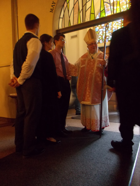 Bishop Morlino and parishioners, after Gaudete Sunday Mass