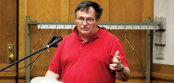 Dave Peters speaks at a City Council Meeting (photo from the Daily Cardinal)